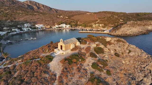 Drone shot of the seaside hilltop Saint George church at sunset in Kapsali, Kythira island, Greece