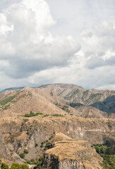 Majestic mountains of Armenia under a blue sky filled with clouds