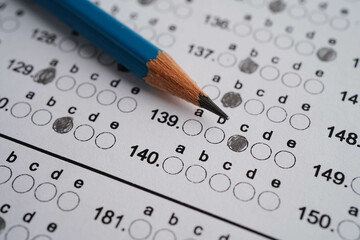 Answer sheets with pencil drawing fill to select choice, education concept.