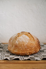 fresh loaf of bread on a linen napkin