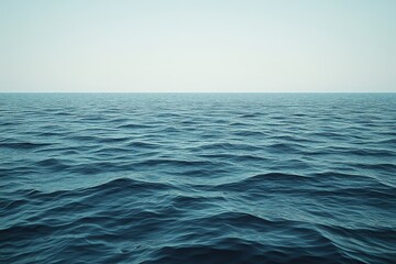 Obraz premium Serene Offshore Wind Turbines in a Vast Open Sea with Gentle Waves and Clear Sky Background, Ideal for Renewable Energy Concepts and Environmental Conservation