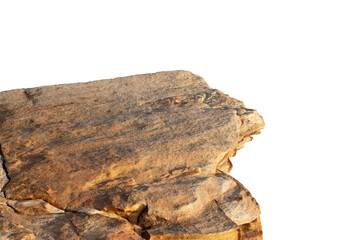 A sunlit rock cliff isolated against a white background. The sun casts warm tones and shadows across the rocky surface, highlighting its layered texture and natural beauty