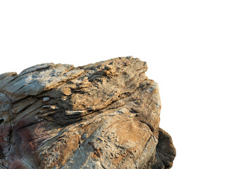 A sunlit rock cliff isolated against a white background. The sun casts warm tones and shadows across the rocky surface, highlighting its layered texture and natural beauty