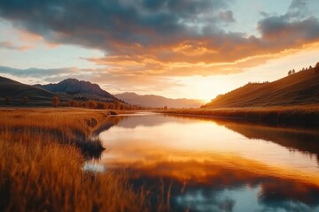 A dramatic sunset over the Powder River, with the sky ablaze in hues of orange and pink reflecting in the water
