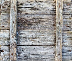 The texture is old faded wood, a wooden box with veins nailed with rusty nails. High quality photo