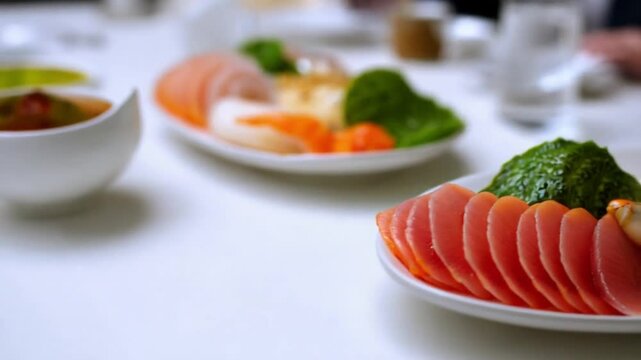Japanese food: Mix sashimi and ebi served with Japanese cooked rice on table. Clean food concept. Focus shift and movement camera. Selective focus and free space for text