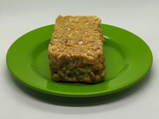 Soybean tempeh. Tempeh is a typical Indonesian food made from fermented soybeans mixed with yeast.