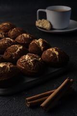 Cinnamon crinkle cookies and cup of coffee on a black background