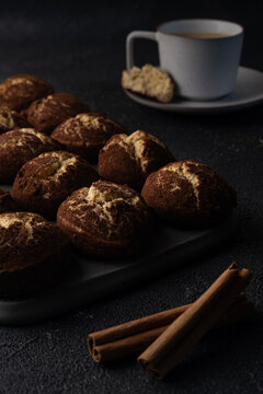 Cinnamon crinkle cookies and cup of coffee on a black background