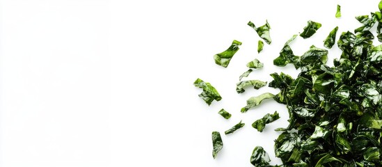 Fried green algae pieces scattered on a clean white background with ample empty space for text placement and branding opportunities.