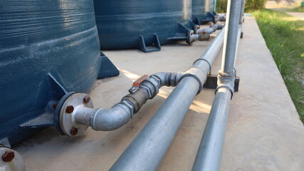 Water pipes and valves. Metal pipes and pipe fittings with ball valves connecting metal pipes to...