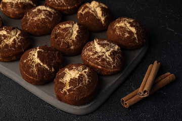 Cinnamon crinkle cookies on a black background, recipe concept. Selective focus, close-up