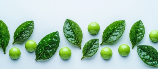 Vibrant green candies interspersed with glossy emerald leaves on a soft white background with ample negative space for text placement