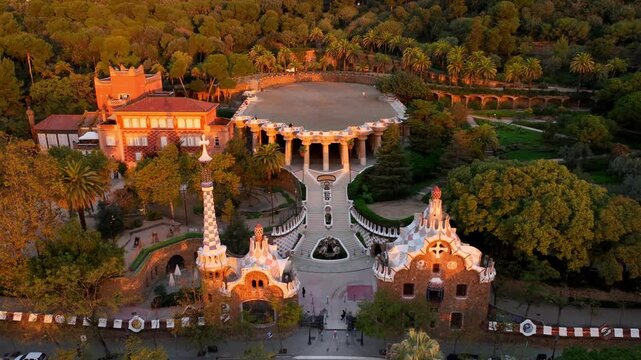 Aerial drone view of Park Guell in the morning, tourist destination in Barcelona. Antonio Gaudi architecture. Sunrise in Barcelona park Guell, Spain