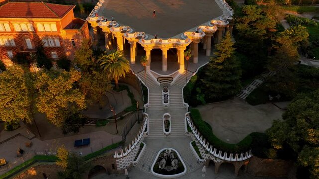 Park Guell aerial shot at sunrise, tourist landmark in Barcelona. Antonio Gaudi architecture. Dawn in Barcelona park Guell, Spain