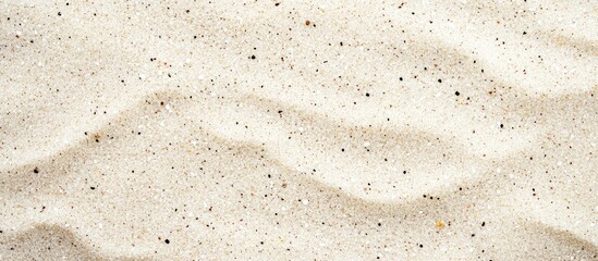 Fine white sand texture with subtle waves and grains suitable for backgrounds or design elements Copy Space