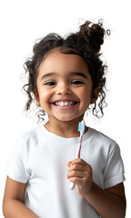 Close-up of a smiling 5-year-old girl holding a toothbrush. Concept of oral hygiene.