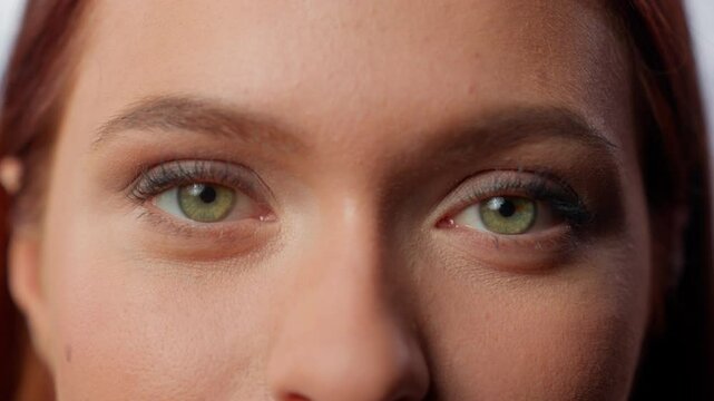 Portrait in company office extreme close up cropped view girl business woman looking at camera eyes closeup vision eyesight medicine health businesswoman female indoors look gaze see laser correction