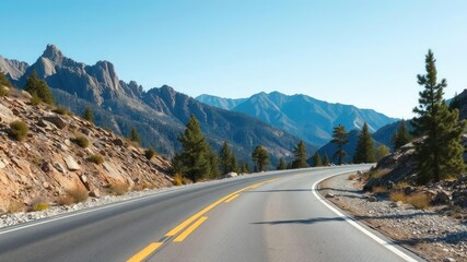 Fototapeta premium An empty stretch of asphalt road winding its way through a rugged mountainous terrain with rocky outcroppings and pine trees in the foreground under a clear blue sky, solitude, asphalt road