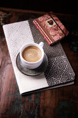 Cup of coffee on wooden background. Soft focus. Copy space.