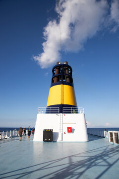Deck and funnel of a ferry sailing over sea, France