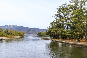 Serene River Landscape with Pine Trees and Mountains,  Amanohashidate, Kyoto, Japan