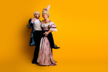 Aristocratic Couple in Vintage Costumes Against Yellow - A Playful Historic and Modern Life...
