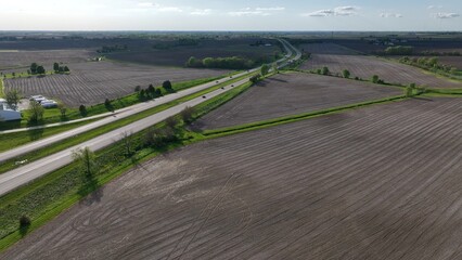 Traveling in interstate highway past Iowa farmland on road trip across America