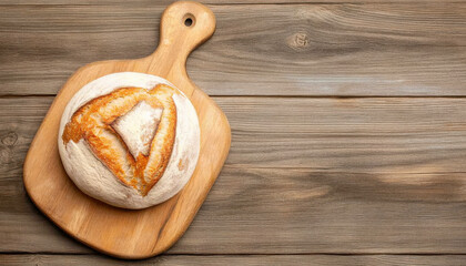Freshly baked sourdough loaf on wooden board, showcasing its crusty exterior and unique shape. Perfect for sharing or enjoying with meal
