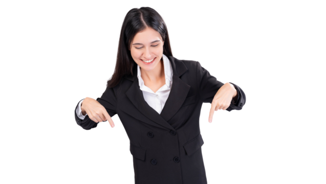 Cheerful young business woman in a black suit, smiling as she points downward with both hands. This image is ideal for emphasizing text, offers or promotional content