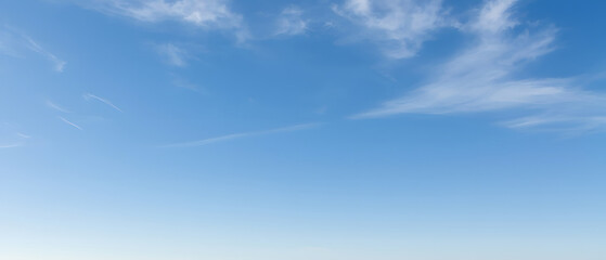 Vast blue sky with wispy cloud trails, dreamy feel © AquaJewels