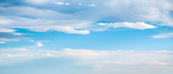 A serene blue sky with scattered clouds, cinematic atmosphere, sharp focus