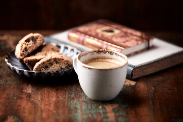 Cup of coffee and Cantuccini (Italian cookie) on dark wooden background. Copy space.
