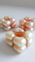 Geometric shapes in subtle pearl and cream tones, interlocking to create a minimalist, abstract pattern with smooth transitions