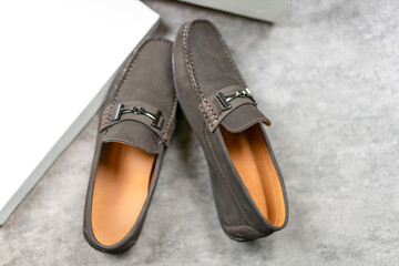 New pair of brown leather loafer shoes.