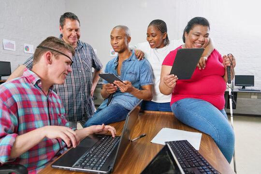 Group of business people sitting at desk in office