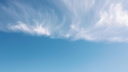 Fototapeta premium Calming blue sky with thin white cirrus clouds floating gently across the horizon, gentle breeze, airy feel, peaceful mood