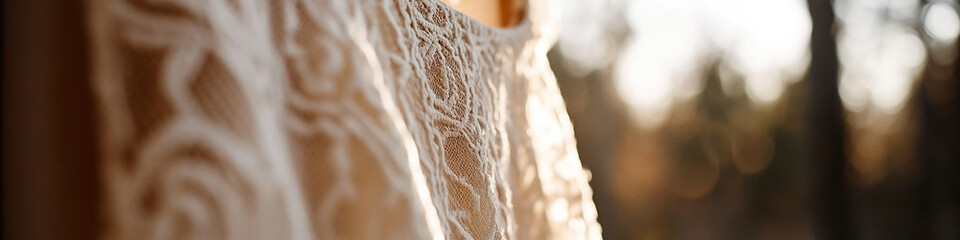 Off-White Lace Fabric Detail Against Blurred Woodland Background