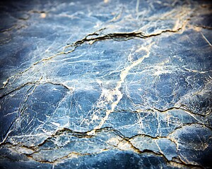 Textured charcoal gray surface with soft light highlights, conveying a calm, minimalist look with subtle elegance and depth