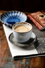 Cup of coffee on wooden background. Soft focus. Copy space.