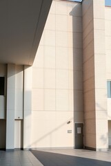 Modern Architectural Interior with Light and Shadow Play featuring Textured Walls
