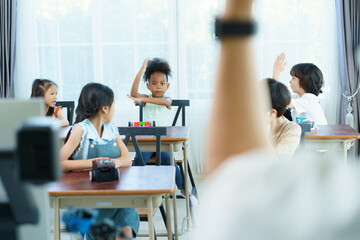 Group of diverse children enjoy learning about the STEM.