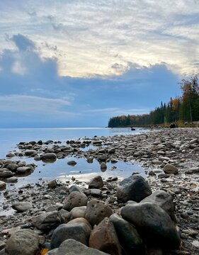Peaceful sunrise on stone covered beach on Manitoulin Island