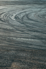 Tire track tread marks burnout on asphalt road