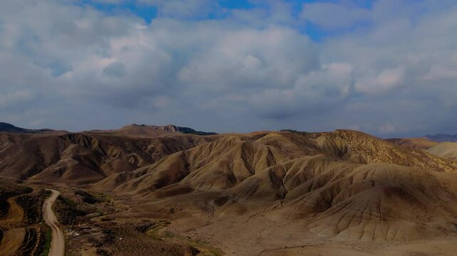 Aerial approaching view of Calanchi del Cannizzola (or Deserto dei Calanchi), known as the &ldquo;Sicilian desert&rdquo;, a series of clay formations in the East part of Sicily