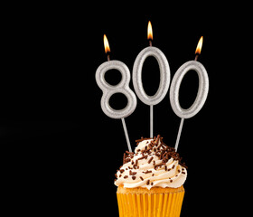 Candles forming the number 800 - Black background.