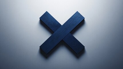 Obraz premium Dark blue wooden X symbol on light grey background.