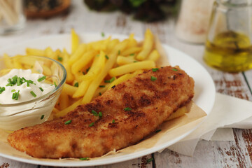 Fish and chips served on the plate, traditional dish of Great Britain