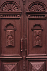 antique wooden carved burgundy doors