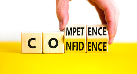 Competence and confidence symbol. Concept word Competence Confidence on wooden cubes. Businessman...